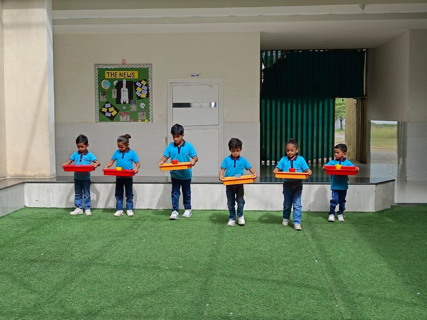 HOLDING TRAY ACTIVITY BY PRE PRIMARY
